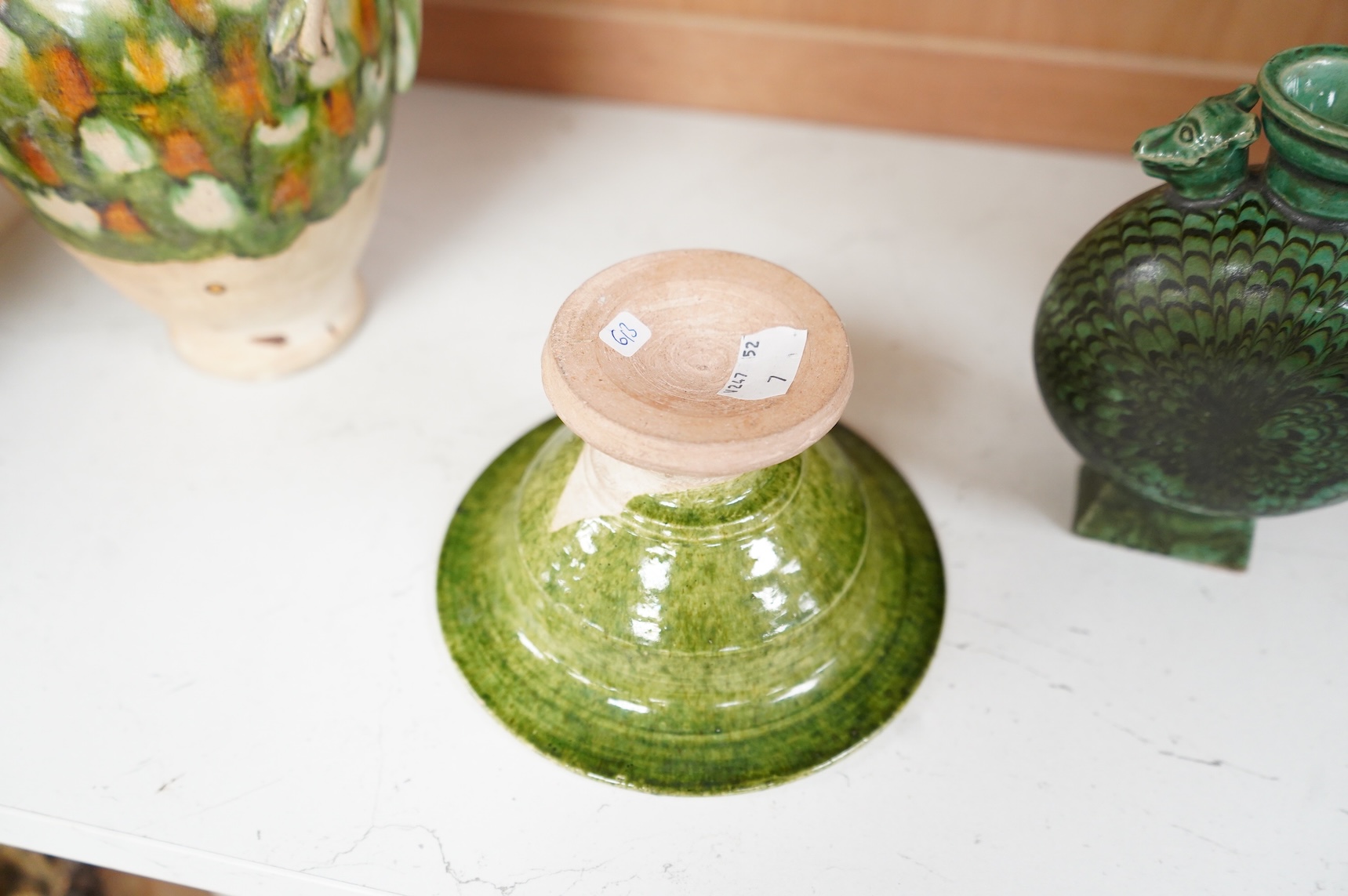 A Chinese agate ware flask, a sancai ewer and a stem dish, largest 26cm high